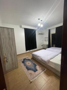 Ένα ή περισσότερα κρεβάτια σε δωμάτιο στο BQq