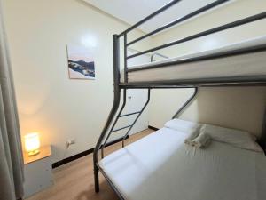 a bedroom with two bunk beds with a ladder at Abode86 Townhouse1-PGT in Gabi