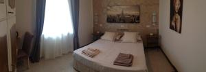 Postel nebo postele na pokoji v ubytování B&B Dolce Risveglio