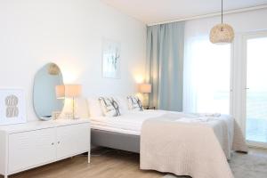 Ένα ή περισσότερα κρεβάτια σε δωμάτιο στο Arctic- apartment Evakko