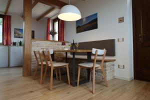 a kitchen and dining room with a table and chairs at mansio maritima in Moresco