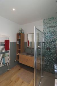 a bathroom with a shower and a sink and a mirror at mansio maritima in Moresco