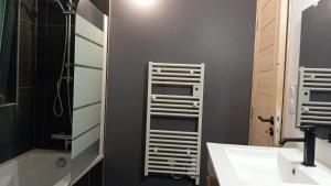 a bathroom with a sink and a shower at Chalet vue panoramique in Fillinges +10 photos