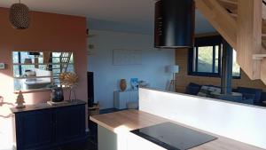 a kitchen with a counter top in a room at Chalet vue panoramique in Fillinges