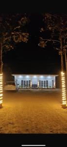 a car parked in front of a building at night at Krishna Cottage in Chauri Chaura