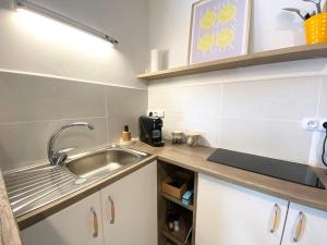 Η κουζίνα ή μικρή κουζίνα στο Appartement Veynes +3 φωτογραφίες
