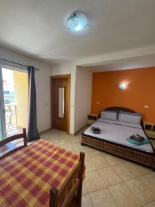 a bedroom with a large bed and a window at Tres Caravelas Studio Flats in Santa Maria +165 photos