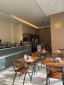 Restoran atau tempat lain untuk makan di Suíte em Rio de Janeiro - Riocentro