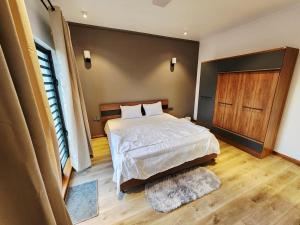Postel nebo postele na pokoji v ubytování VLAP Residence