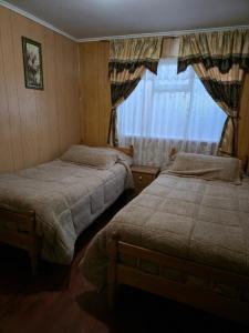 Postel nebo postele na pokoji v ubytování Hostal Josmar Natales + 6 fotografií