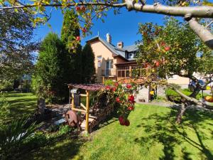 a house with an apple tree in the yard at Lipoffka in Lipova Lazne
