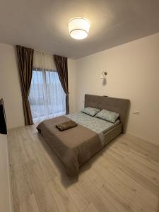 Ένα ή περισσότερα κρεβάτια σε δωμάτιο στο Apartament in Ploiesti 1 +8 φωτογραφίες