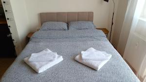 Ένα ή περισσότερα κρεβάτια σε δωμάτιο στο Terminal