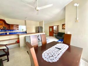 a kitchen and dining room with a table and chairs at Casa de descanso en Doradal Hacienda Napoles in Doradal +5 photos