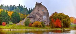 a stone house on an island in the water at TropiKana in Courcouronnes