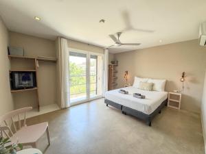 Postel nebo postele na pokoji v ubytování Boutique Hotel & apartments JT Curaçao + 50 fotografií