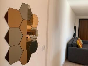 a room with a wall with a mirror on the wall at Al Campanaro, Romantic retreat in the village in Castelluccio Superiore +1 photo
