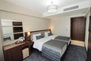 Katil atau katil-katil dalam bilik di Pisa Hotel