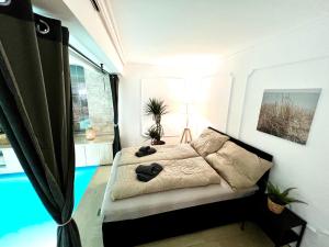 Ένα ή περισσότερα κρεβάτια σε δωμάτιο στο UNO POOL Apartment