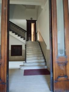 an empty hallway with stairs in a house at Al Castello 2 in Bari