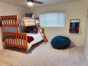 a bedroom with a bunk bed and a blue ball at Old Fig House - Historic Fig Garden Neighborhood in Fresno +23 photos