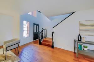 a living room with a staircase and a chair at Cozy Room#1 Best Moscato in Clovis