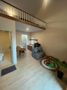 a living room with a blue couch and a table at Apartment in Sanur Harbour in Sanur