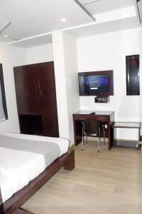 Μια τηλεόραση ή/και κέντρο ψυχαγωγίας στο Hotel Srida Jaipur