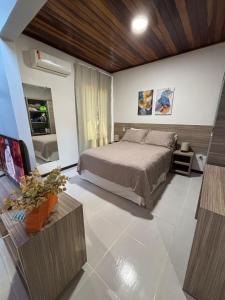 a bedroom with a bed in a room at Chale Pitanga 38 in Pipa +56 photos