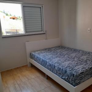 Ένα ή περισσότερα κρεβάτια σε δωμάτιο στο Casa Amarela