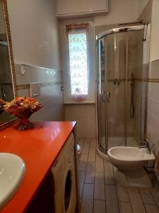 a bathroom with a shower and a sink and a toilet at Casa di Doria in Deiva Marina