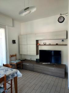 a living room with a large flat screen tv at Casa di Doria in Deiva Marina +20 photos