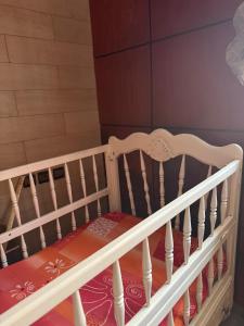 a crib in a room with at Apartment in downtown Fez in Fès