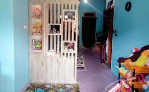 a toy room with a white door with shelves at Chinta Khanza 