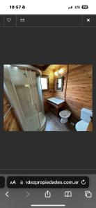 a bathroom with a shower and a toilet in a room at Cabanas Gael in Mar de las Pampas +32 photos
