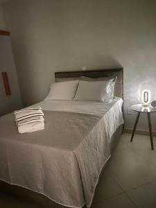 Ένα ή περισσότερα κρεβάτια σε δωμάτιο στο Lar Urbano