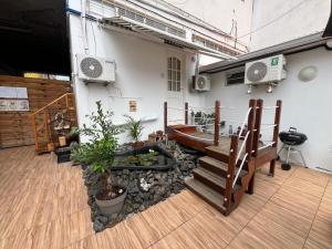 a room with a staircase and a building at Le Corail - Résidence Terre et Truffes in Le Lamentin