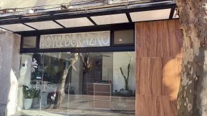 a store front of a building with a sign on it at Hotel Durazno in Durazno