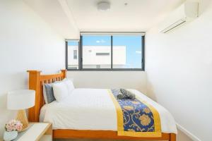 Katil atau katil-katil dalam bilik di SkyPark Oasis Retreat 2Br@ close to Olympicpark