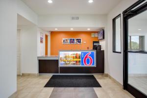 a waiting room with a tv in a building at Motel 6-White House, TN in White House