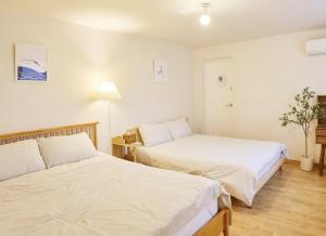 Ένα ή περισσότερα κρεβάτια σε δωμάτιο στο NOOKS, Seoul Sadang, Local sensibility of Korea