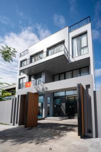 a large white building with a lot of windows at TS Villa in Danang