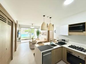 a kitchen with a sink and a stove top oven at Baia Krystal P4, 1A in Cartagena de Indias