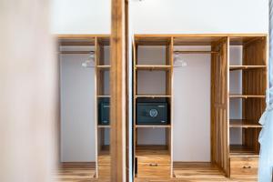 a room with a closet with a computer in it at Villa Smarana 2bdrs with private pool in Balangan in Bingin Beach +11 photos