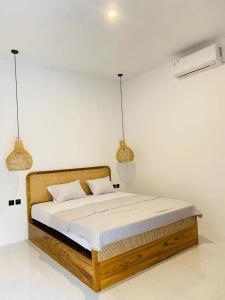 En eller flere senge i et værelse på PAN Homestay