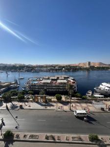 a view of a marina with boats in the water at NubaNest GuestHouse in Aswan
