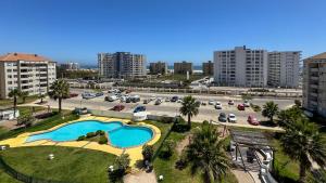 an aerial view of a parking lot with a pool at Nova Pacifico in La Serena +9 photos