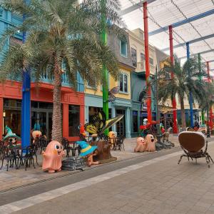 a street with a group of inflatable people in a city at NovaWonderland Ho Tram Villa in Xuyên Mộc
