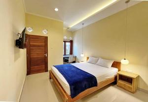 Кровать или кровати в номере Mandala Living