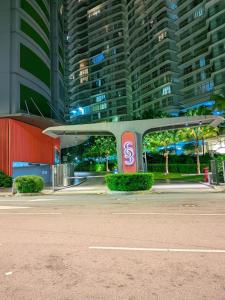 an empty street in front of some tall buildings at Sky Suites KLCC Luxury Homestay in Kuala Lumpur